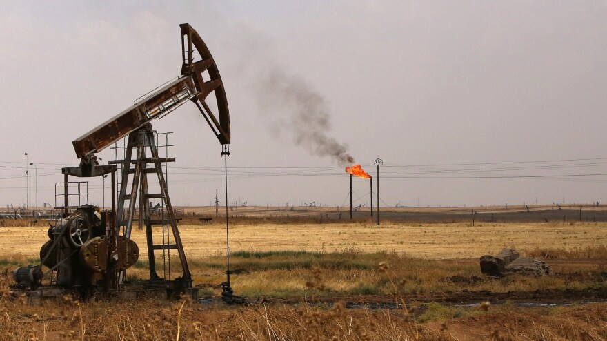 Oil well pumps are seen in Syria's northeastern Hasakeh province in 2015. President Trump is renewing his push for U.S. control of Syrian oil.