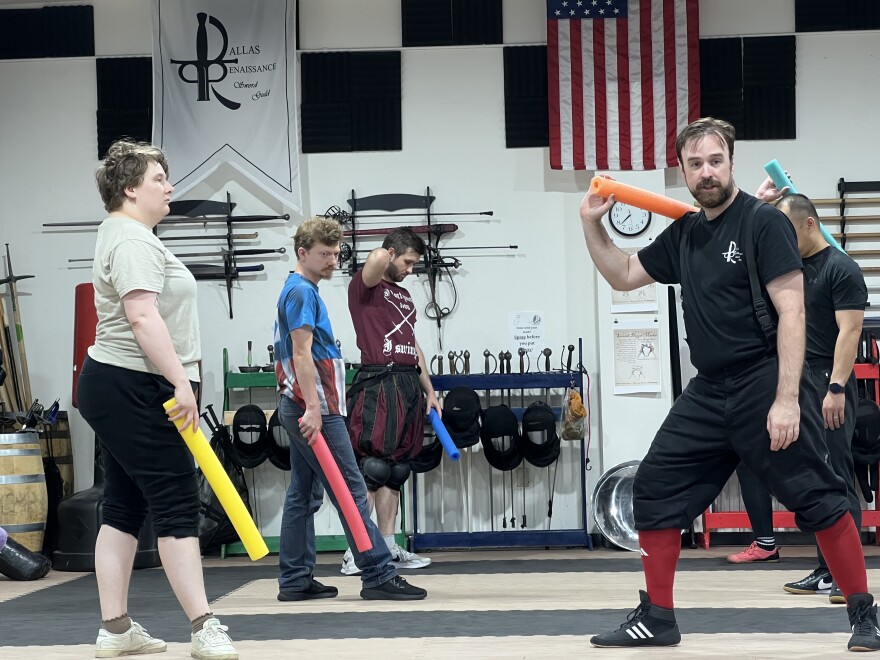 Samantha Sanford (left) and Will Phillips lead a class at the Dallas Renaissance Sword Guild.