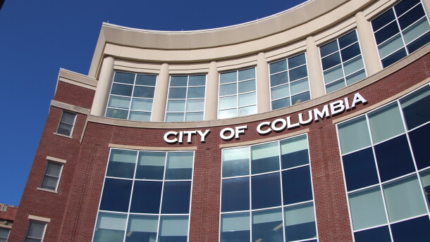 The Columbia red brick government building affixed with letters spelling out "City of Columbia."