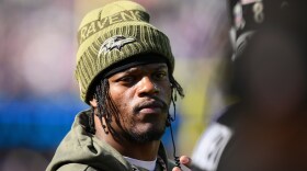 Baltimore Ravens quarterback Lamar Jackson (8) stands on the sideline during the first half an NFL football game against the Chicago Bears, Sunday, Oct. 26, 2025, in Baltimore. (AP Photo/Nick Wass)