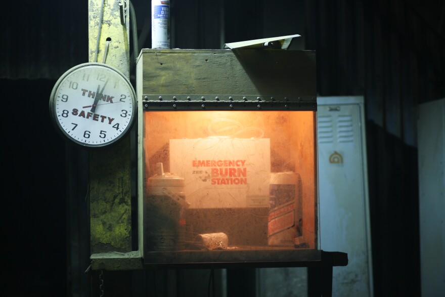 A safety station at the foundry is covered in a layer of dust from the furnace. Safety is a top priority since a small drop of molten metal can cause serious burns.