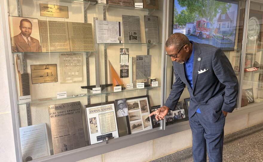 Inside the entrance of the Milwaukee Fire Department headquarters, there's a display case with photos, tools, and other memorabilia dedicated to Alonzo Robinson Jr.