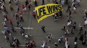 Marchers move down Front Street during the Ohio March for Life after a rally at the Ohio Statehouse in Columbus, October 6th, 2023.