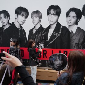K-pop fans arrive for the BTS World Tour outside Tokyo Dome, Friday, April 17, 2026, in Tokyo.