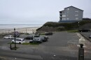 A parking lot next to the beach