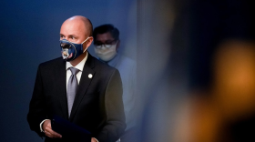 A photo of Spencer Cox wearing a face mask. 