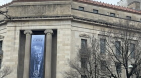 A banner showing President Donald Trump hangs on the Department of Justice on Feb. 20, 2026.