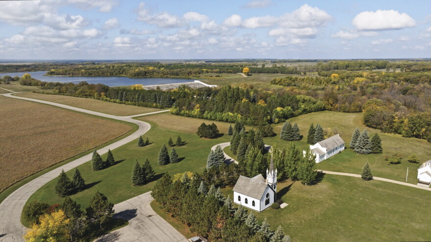 An aerial view of Icelandic State Park in northeastern North Dakota shows the changing fall colors across the park’s wooded landscape.