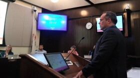 John Houseal speaks at podium