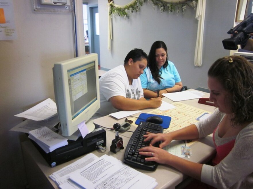 Same sex couple fills out marriage application at Buffalo's city clerk's office Sunday