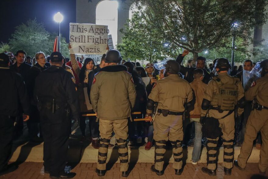 State Troopers in riot gear pushed protesters away from the building where white nationalist Richard Spencer was speaking at Texas A&M in 2016.  