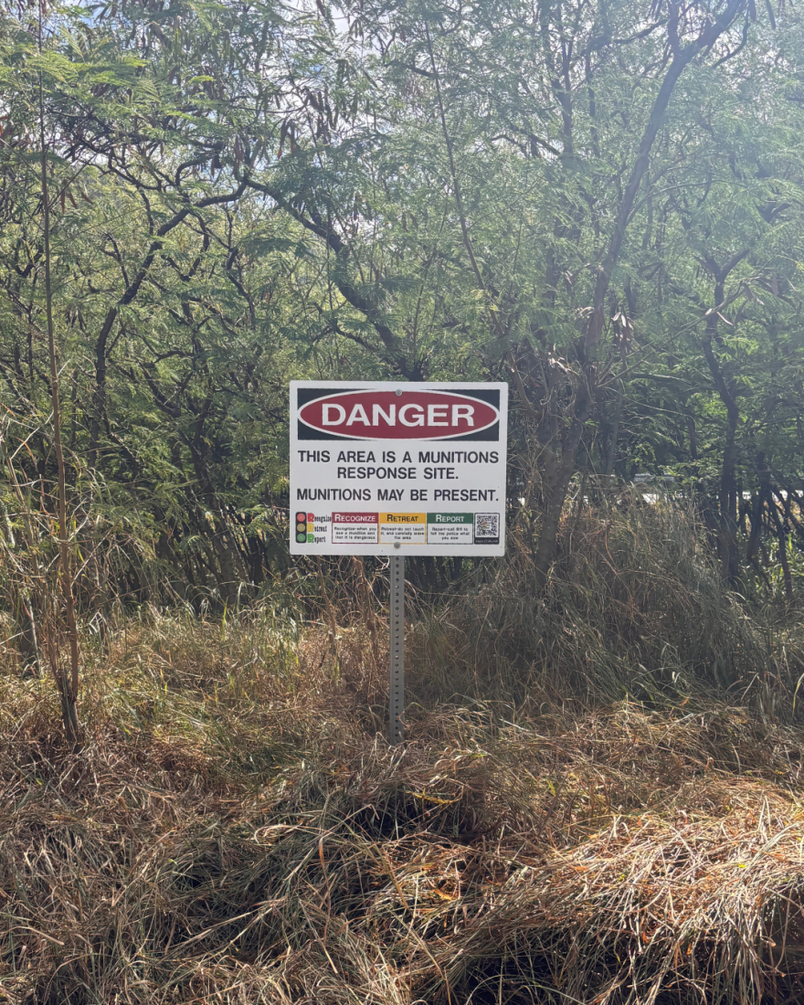Multiple munitions response signs are posted throughout Mākua Beach.