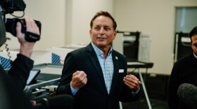 Iowa Secretary of State Paul Pate and Polk County Elections Director John Chiodo test vote counting machines in a public meeting ahead of the 2022 midterms.
