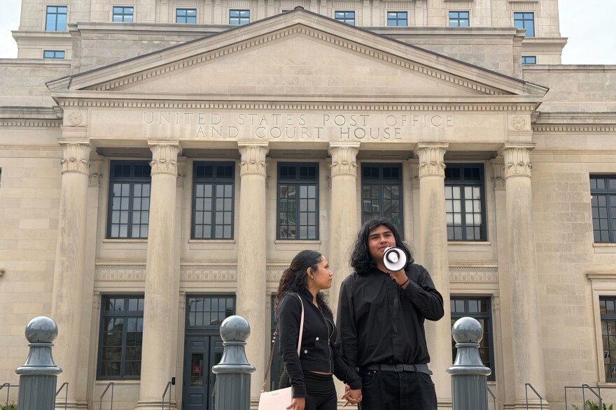 Miguel Angel Garcia Martinez's brother, Brian, speaks before a crowd in front of the federal courthouse in uptown Charlotte on Thurs., Nov. 20, 2025.