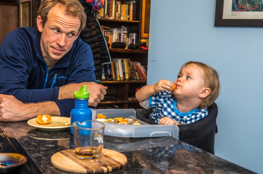 Lowell Bailey eats with daughter Ophelia at home. She and Bailey's wife, Erika, travel with Bailey on the World Cup circuit. At last year's World Championships, Erika ran and cheered alongside the final stretch with Ophelia, then 8 months old, strapped to her chest.