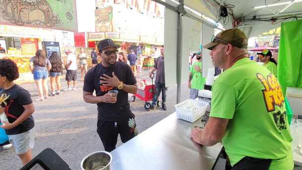 Jim Hasbrouck takes a customer's order at the Fried Specialties booth.
