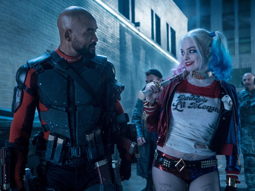 Will Smith stars as Deadshot, alongside Margot Robbie's Harley Quinn in the upcoming <em>Suicide Squad</em> movie.