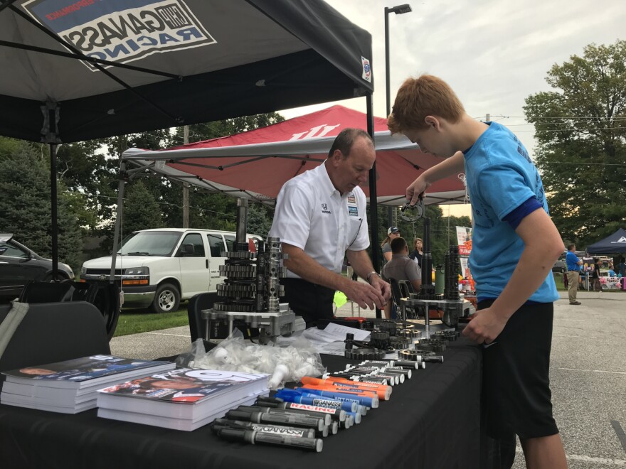A student works on an engineering activity at a booth for the Area 31 Partnership Day.