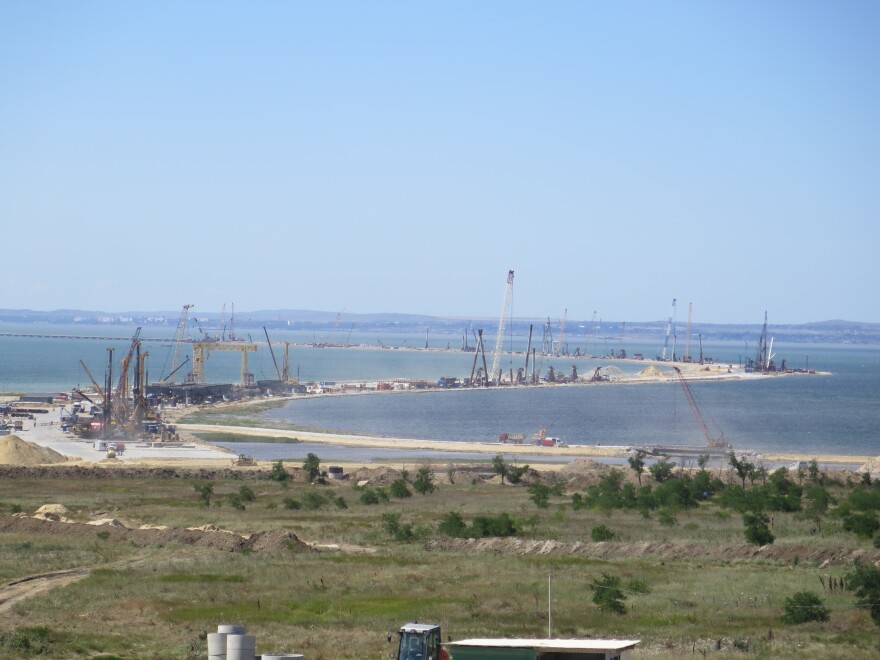 The zigzagging route of the Crimea Bridge, seen from the Russian side, bristles with cranes and construction equipment. The $4.3 billion project is expected to be finished in 2019.