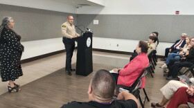 Bernalillo County Commission Chair Adriann Barboa, left, looks on as Bernalillo County Sheriff John Allen addresses those who attended a press conference on Wednesday announcing the proposed declaration, which will be aimed at expanding revocery services and treatment options.