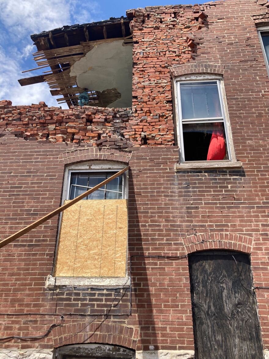 One side of the Williams home on Walton Avenue in the Fountain Park neighborhood of St. Louis on May 20. The house sits between an alley and a another house, also badly damaged on May 16, 2025.