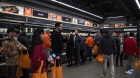 Customers shop at Amazon Go on Monday, January 22, 2018, on 7th Ave., in Seattle. 