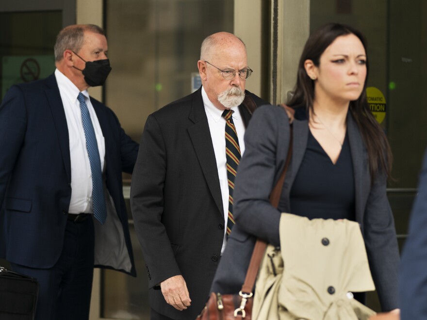 Special counsel John Durham, center, the prosecutor appointed to investigate potential government wrongdoing in the early days of the Trump-Russia probe, leaves federal courthouse in Washington, Monday, May 16, 2022.
