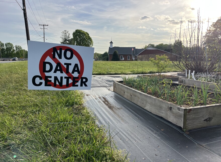No data center sign stands in a Rural Hall field