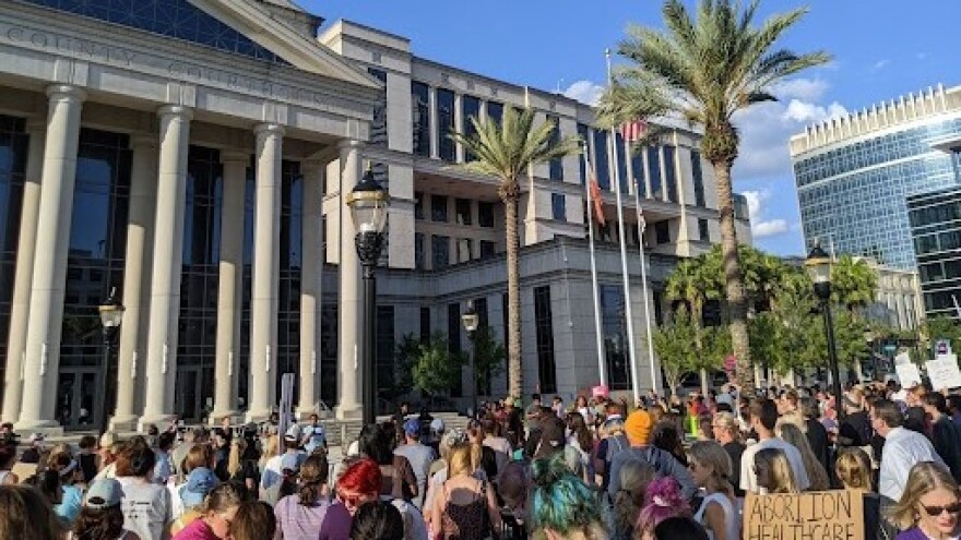 Protesters rally at the Duval County Courthouse on Wednesday, May 4, 2022.