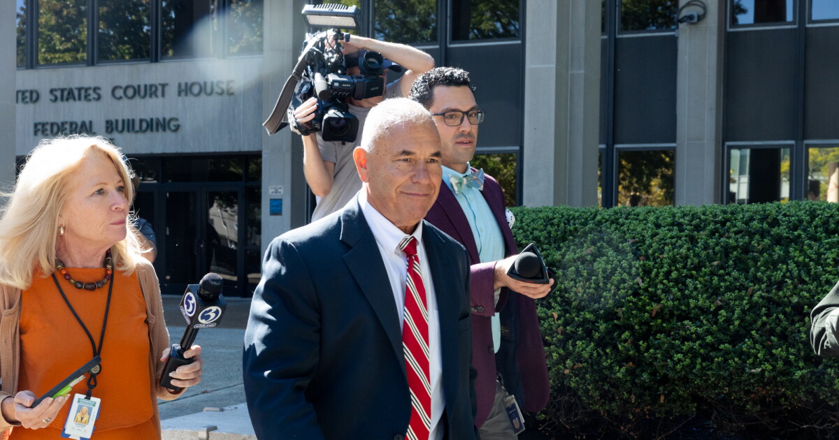Photo: ctpublic.org Reporters follow Kosta Diamantis as he leaves the U.S. District Court in Bridgeport during a break in his trial on October