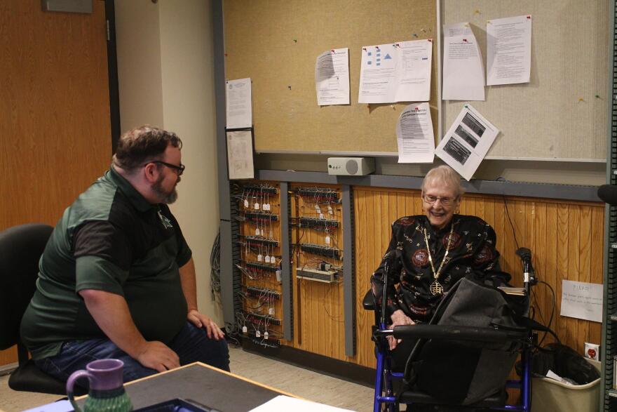 Leora Stutes (right) chats with WKAR's Broadcasting Services Program Manager Jamie Paisley (left) while he hosts the classical show Thursday, May 21, 2026.