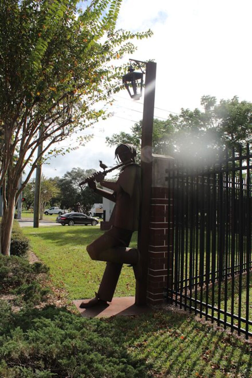 'Man Playing Flute' by Columbian artist Edgardo Carmona outside IMAG History and Science Center at corner of Cranford Avenue and Dr. Martin Luther King, Jr. Boulevard.