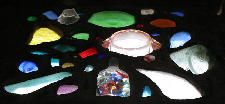 Old bottles and salvaged glass make up the "stained glass" windows in Broken Angel.