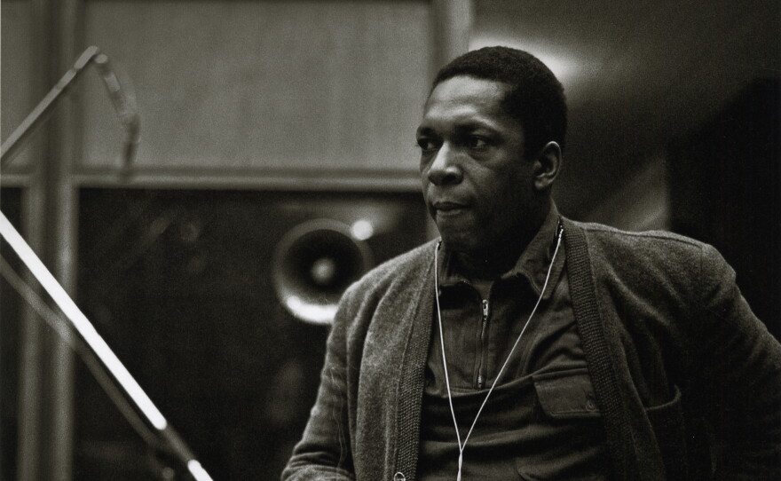 John Coltrane at the recording sessions for <em>A Love Supreme</em>. In addition to the images already published, photographer Chuck Stewart recently unearthed never-before-seen shots of the session, including this one. Per the request of Chuck Stewart's family, reproduction of these photos elsewhere is prohibited.