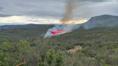 A fire burns near Ten Peaks Mesa Road, south of Dotsero, on July 22, 2026.
