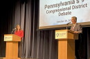 Democratic challenger Rachel Wallace, left, listens as Republican U.S. Rep. Dan Meuser speaks during a Tuesday, Oct. 20, 2026 debate between the two Pennsylvania 9th Congressional District candidates at Penn State Schuylkill in Schuylkill Haven.