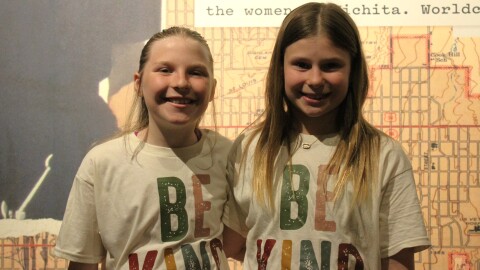 Lizzy Chobad, left, and her best friend, Jetlyn Friesen, pose for a photo while wearing "Be Kind." shirts. The shirt is one of two that Lizzy is selling to combat school meal debt in the Valley Center school district.