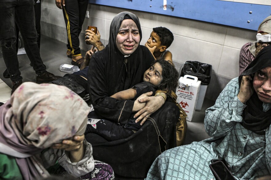 Tues., Oct. 17: Palestinians wounded at Ahli Arab hospital sit on the floor at al-Shifa hospital, in Gaza City, central Gaza Strip.