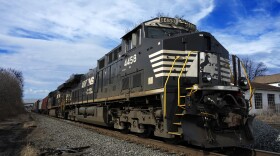 A Norfolk Southern freight train passes through East Palestine, Ohio. 