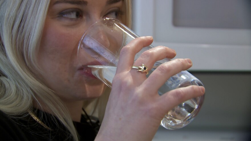 IU Public Health student Samantha Bettinger takes a sip of her tap water in the late summer when algae issues on Lake Monroe were causing taste and odor issues with the city of Bloomington's water.