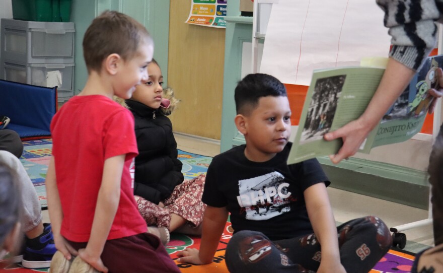 First grade teacher Emery Griffin reads a book in Spanish to her students at Bakersville Elementary School in Manchester. 