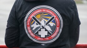 About 65 ski patrollers, mountain safety staff and supporters practice picket to urge the Park City Mountain to move toward a contract resolution.