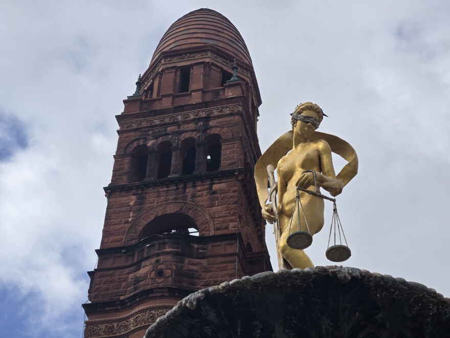 The 1890s Bexar County Courthouse features Lady Justice fountain at its main entrance with a towering "beehive" dome spiraling above