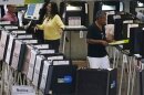 A poll worker directs voters at an early voting site, Monday, Oct. 31, 2022, in Miami. Midterm elections are Nov. 8.