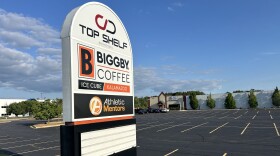 The sign in front of the Biggby Ice Cube in Texas Township advertises the facility an adjoining restaurant, CD Top Shelf.
