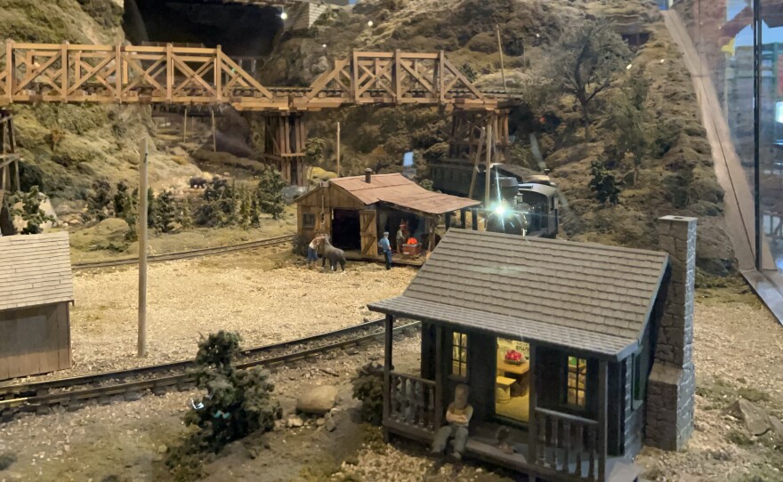 Over 100 trains travel through the model train display's camps, villages, towns and cities.