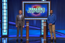 UWM engineering graduate student Avinash Rejendra (right) stands on the set of “Jeopardy!” with host Ken Jennings