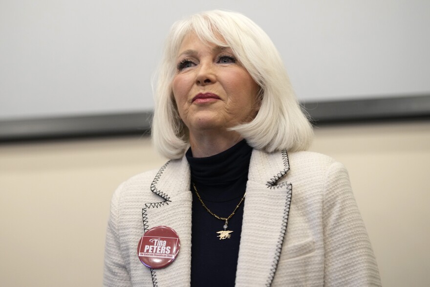 Former Mesa County Clerk Tina Peters speaks during a debate for the state leadership position Saturday, Feb. 25, 2023, in Hudson, Colo. 