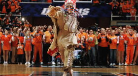 In this Feb. 21, 2007 file photo, University of Illinois mascot Chief Illiniwek performs for the last time during an Illinois basketball game in Champaign, Ill. Illinois says the school is ending its tradition of playing "war chant" music during sporting events. (Seth Perlman/AP)
