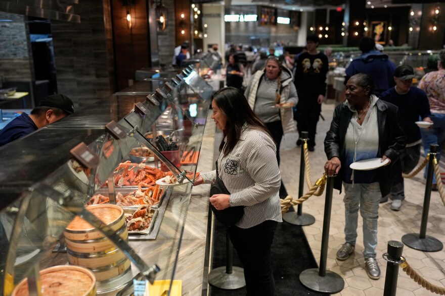 People are served food at the A.Y.C.E Buffet in the Palms resort-casino Wednesday, Jan. 28, 2026, in Las Vegas.